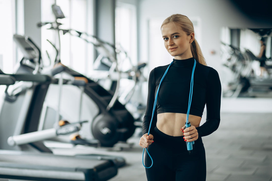 Woman using jumping rope at the gym