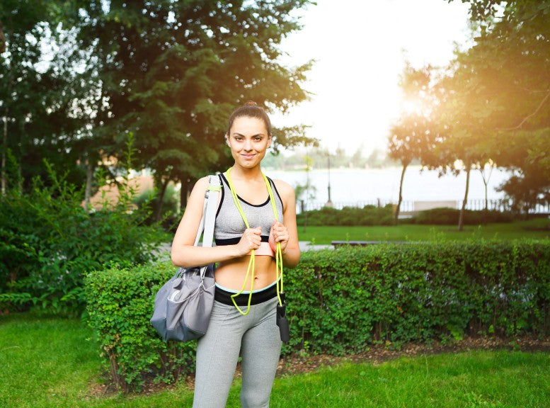 woman-with-jumping-rope-beautiful-young-woman-standing-with-a-jumping-rope-in-her-hands-and-sport